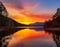 An image of a vibrant sunset over a serene lake, with colorful reflections shimmering