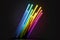 Image of vint neon glow sticks forming rainbow, abstract, colors