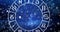 Image of virgo star sign inside spinning wheel of zodiac signs over stars on blue sky