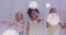 Image of white bokeh spots over happy diverse schoolgirls waving by lockers