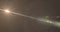 Image of white light with beam and prismatic lens flare on grey background