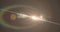 Image of white light with beam and prismatic lens flare on grey background