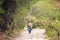 Image of a woman walking in Andean Villa in Peru.