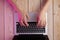 Image of womanâ€™s hands typing fast on laptop keyboard. View from above. Remote work concept image