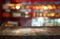 Image of wooden table in front of abstract blurred background of restaurant lights