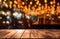 Image of wooden table in front of abstract blurred restaurant lights background