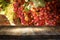 Image of wooden table in front of blurred vineyard landscape. Ready for product display montage.