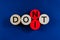 Image of word Don`t spelled on wooden pegs with second to the last circle replacing to spell the word Do It