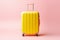 Image of yellow baggage over pink background