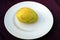 This is the image of a yellow mango fruits which is put in a plate