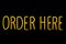 Image of yellow Order here neon sign