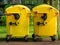 Image of Yellow waste Containers, Recycling bin for special Rubbish, during hail and rainy weather