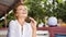 Image of young red hair and pretty woman with cup of coffee laughing in cafe