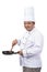 Images of chef cooking with holding pan and spatula look at the camera