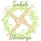 Imbolc Blessings. Beginning of spring pagan holiday. Brigid`s Cross in a wreath of green leaves