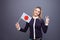 Immigration and the study of foreign languages, concept. A young smiling woman with a Japan flag in her hand.