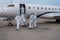 A Immigration team in protective clothing is checking crew and private jet after landing in China