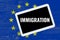 Immigration, text on tablet pc over eu flag