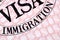Immigration visa document stamp passport page close up