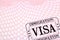 Immigration visa document stamp passport page close up