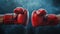 Impact moment between two red boxing gloves. Fist bump. Dark background. Concept of competition, opposing forces