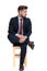Impatient young businessman sitting on wooden chair