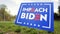 Impeach Biden yard sign on a roadside