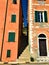 Imperia city, Liguria region, Italy. Narrow ancient street, buildings and colours