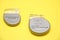 Implantable cardiac defibrillator devices isolated on yellow background.