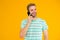 Importance of being communicative. Happy man talk on mobile phone yellow background. Verbal communication. Mobile