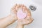 Importance of personal hygiene care. Flat lay view of child washing dirty hands with pink heart shape soap bar, lot of foam. Copy