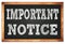 IMPORTANT NOTICE words on black wooden frame school blackboard