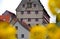 Imposing half-timbered building from the middle ages with a large facade clock
