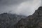 Imposing and majestic limestone peaks stand tall amidst the fog