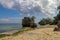 Impossible Beach in Bali Indonesia, nature vacation background. Giant boulders and rock formations jutting out over the