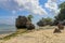 Impossible Beach in Bali Indonesia, nature vacation background. Giant boulders and rock formations jutting out over the