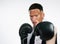 Impossible is nothing. Portrait shot of a handsome young male boxer with vitiligo posing in studio.