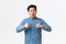 Impressed and astounded handsome asian guy showing thumbs-up and looking astonished at camera, congrats person with