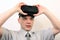 An impressed, relieved, flabbergasted man wearing Oculus Rift VR virtual reality headset