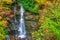 Impressionistic Style Artwork of an Autumn Waterfall