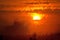 Impressionistic Style Artwork of the Sun Setting in a Smoky Western Sky