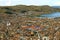 Impressive Aerial view of Lake Titicaca, the Highest Navigable Lake in the World with Puno Cityscape, Peru