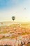 Impressive beautiful flight of balloons over mountains at dawn