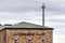 Impressive brick building of Glenmorangie  Distillery with an iron chimney in Tain, United Kingdom