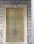 Impressive bronze metallic door with marble frame