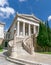 Impressive curved marble stairs and neo-classical facade of the natiomal library of Athens, Greece.