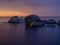 Impressive dawn on the lake. Stones in the water