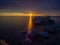 Impressive dawn on the lake. Stones in the water