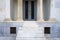Impressive entrance with marble columns, classical architecture building detail