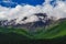 An impressive mountain range in the clouds in Kuray steppe of Altai Krai